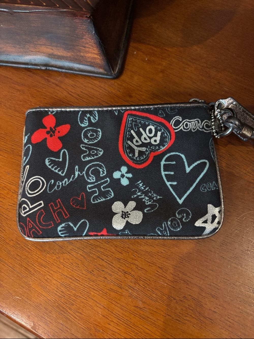 Coach Black Poppy Print Wristlet with Red & Light Blue Accents - Picture 4 of 6
